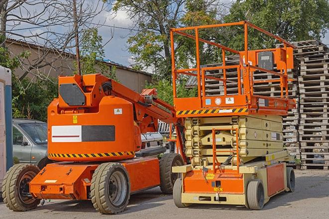 industrial forklift transporting goods in a warehouse setting in Fresno